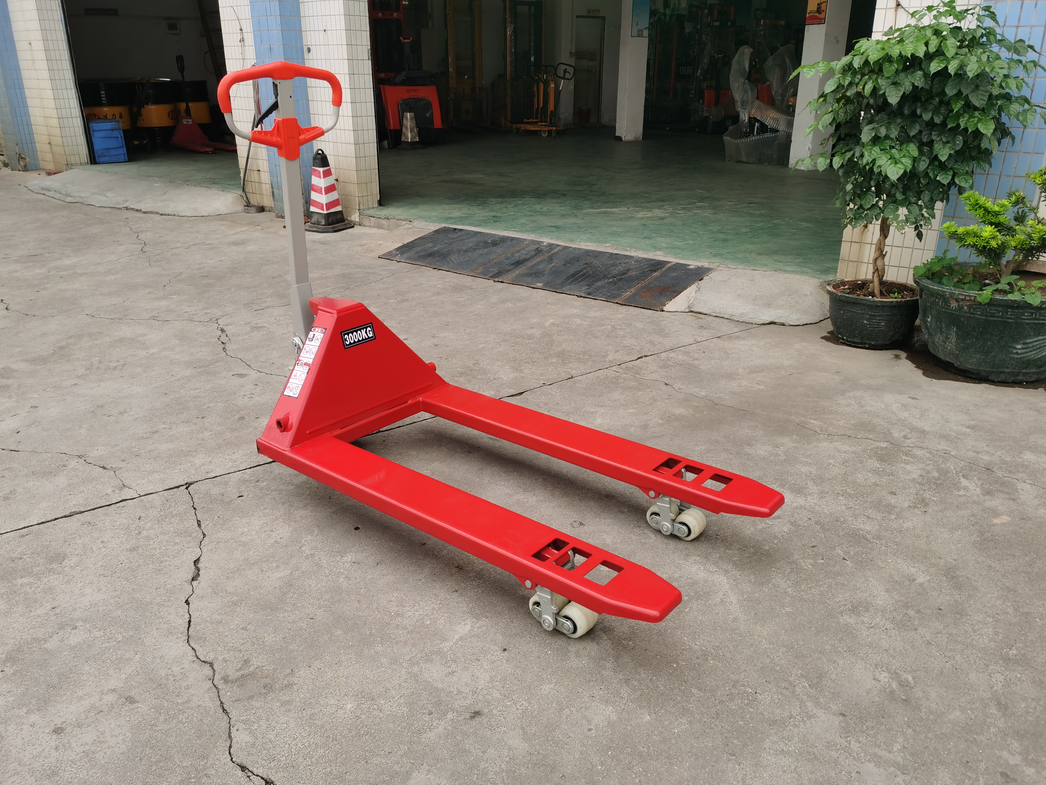 Ergonomic hand pallet truck red handle nylon wheels fork entry manual jack material handling